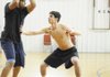 Fayetteville Christian’s Blake Riley, right, guards Tony Johnson, left, during practice Tuesday in Fayetteville.