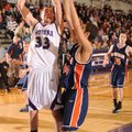Fayetteville senior forward Adam Nobel, right, takes a shot in the lane as Rogers Heritage junior fo...