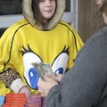 Josie McFarland, 10, with Girl Scout Troop 5389 in Rogers, sells cookies outside the Bentonville Sam...