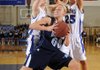 Springdale Har-Ber’s Halee Castleman is pressured under the basket by Rogers High’s Hayley Clark, left, and Jazmin Coultas during their game Tuesday in Rogers. 