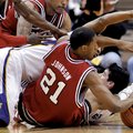  Arkansas forward Delvon Johnson (21) goes after a loose ball with teammates Courtney Fortson, left,...