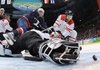  USA's Zach Parise (9) scores past Switzerland's goalie Jonas Hiller and Switzerland's Thierry Paterlini (23) in the third period of a men's quarterfinal round ice hockey game at the Vancouver 2010 Olympics in Vancouver, British Columbia, Wednesday, Feb. 24, 2010. The USA won 2-0. 