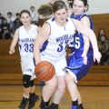 STAFF PHOTO SARAH BENTHAM 
Fayetteville Woodland’s Sydney Trumbo 
dribbles past Fort Smith Trinity...
