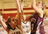 Gentry’s Kendra Boyd, right, takes the ball to the hoop as Ozark’s Emily Hawkins defends Wednesday during the first round of the 4A North Region tournament on Wednesday in Farmington. STAFF PHOTO J.T. WAMPLER