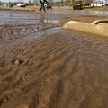 STAFF PHOTO J.T. WAMPLER 
Workers from Fayetteville Water and Sewer clear debris Wednesday after a ...