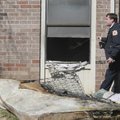 STAFF PHOTO J.S. WEDGEWORTH 
Chief Tom Jenkins of the Rogers Fire Department passes by the window o...