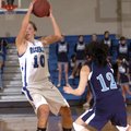 Rogers High’s Morgan Hook looks to pass the ball under pressure from Springdale Har-Ber’s Jessica Ol...