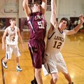 Lincoln sophomore Zach Summers makes a move in the post around Lavaca senior Tyler Daniels during th...