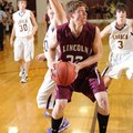 Lincoln junior Dakota Leming makes a move around Lavaca junior Robert Blair, left, during the first ...