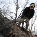 Brad Jones of Stark Masonary fills a trench with concrete Wednesday while preparing the footing for ...