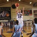 Fayetteville senior Taylor Cochran shoots a jumper over Fort Smith Southside’s Denzel Massey during ...