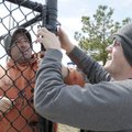 FENCE ME IN - Rick Pace, left, and Josh Smith with Ozark Fence Company hang fence Thursday at Vetera...