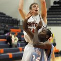 Rogers Heritage senior forward Miles Johnson shoots over Fort Smith Southside junior Denzel Massey o...