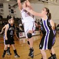 Bentonville’s Madison Byford takes the ball to the basket over Fayetteville’s Hannah Breden during t...