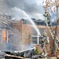 Firefighters from two Bella Vista stations fight to control a blaze Friday that destroyed the home o...