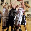 Fayetteville’s Sierra Shipley is fouled under the basket while pressured by Bentonville’s Madison By...