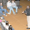 Ron Harris gives a motivational speech to young members of the Celebrate Family Church at the Villag...