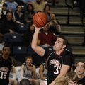 Springdale High junior guard Sheldon Baird shoots over the Springdale Har-Ber defense in the first h...