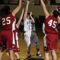 Springdale Har-Ber sophomore Jessica Olson shoots between Springdale junior Jasmine Gilyard, left, a...