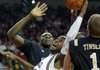 Arkansas' Marshawn Powell, center front, grabs a rebound over Vanderbilt's Jermaine Beal, center left, and Brad Tinsley (1) during the first half of an NCAA college basketball game in Fayetteville on Saturday.