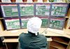 A Kazatomprom employee monitors the uranium pellet-making process from a computer station at the Ulba metallurgical plant in Ust-Kamenogorsk, Kazakhstan, in this 2007 photo.

