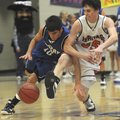 Rogers High’s Wyatt Hively, left, battles Rogers Heritage’s Evan Giesen for a loose ball during Frid...