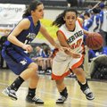 Rogers Heritage’s Yalile Johnson, right, tries to drive around Rogers High’s Madeline Fusillo during...