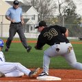 Rogers High’s Alex Shelor slides past the tag attempt by Bentonville’s Matt Russell on April 20 duri...