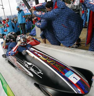  The United States' USA-1, with Steven Holcomb, front, Justin Olsen, Steve Mesler, and Curtis Tomasevicz, celebrate their gold medal finish during the men's four-man bobsled final competition at the Vancouver 2010 Olympics in Whistler, British Columbia, Saturday, Feb. 27, 2010.