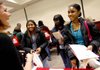Laura Moix (from left) with the Study Abroad office talks with Whitney Gilford, 17, of Neosho, Mo., and Sheridan McKisick, 16, and Jamena Cash, 17, both of Little Rock, during the recent Diversity Impact event at the University of Arkansas in Fayetteville.

