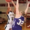 West Fork sophomore forward Melissa Jones, left, puts a shot up over Ozark senior forward Miranda Ea...