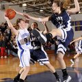 Fayetteville Woodland’s Sarah Smith, left, looks to pass the ball under pressure from Greenwood’s Lu...