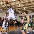 Fayetteville Woodland’s Jawan Smith takes the ball to the basket over Alma’s Brock Widders, right, d...