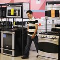 Manuel Almaraz, salesman at Tucker’s Appliances, walks through the store Friday in Springdale.