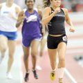 Bentonville sophomore Brittani Reagan races to the finish line to win the 400 meters Feb. 20 in the ...