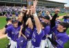 Fayetteville players celebrate their 2-0 win over Fort Smith Southside to win their fourth consecutive state championship on May 8 in Baum Stadium in Fayetteville.