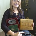 Nikki Pinto, 17, shows her plaque from the International Defensive Pistol Association national champ...