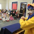 CLOWN MAGIC - Alondra Paredes, 11, performs a magic trick Saturday at the Rogers Public Library duri...