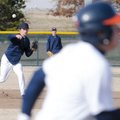 Rogers Heritage’s Hayden Bough throws out a runner during practice Thursday at Veterans Park in Roge...