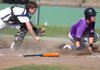 Fayetteville senior Adam Baker looks for the call after sliding home in front of the tag of Springdale Har-Ber’s Devin Cook in the third inning on April 21 in Fayetteville. Baker was called safe as the Bulldogs went on to win 5-2.