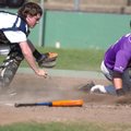 Fayetteville senior Adam Baker looks for the call after sliding home in front of the tag of Springda...