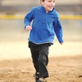 STAFF PHOTO ANDY SHUPE 
Graham Witte, 5, of Fayetteville smiles while running the bases after his b...