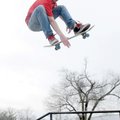 STAFF PHOTO DAVID FRANK DEMPSEY 
Randy Bain makes a high jump while skateboarding with friends Sund...