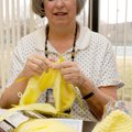 STAFF PHOTO DAVID FRANK DEMPSEY 
Candy Prudhomme uses five double-pointed needles to knit a cap dur...