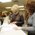 STAFF PHOTO J.T. WAMPLER 
Washington County Judge Marilyn Edwards, left, signs the paperwork to run...