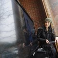 TAFF PHOTO J.T. WAMPLER 
Bethany Springer of Fayetteville sets up a video monitor Monday as part of...