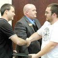 Paul Dilbeck, left, La-Z-Boy training coordinator, congratulates Justin Grotts after presenting him ...