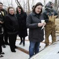 Katie Mihalevich reads the plaque Tuesday describing the history of the Butterfield Overland Mail Ro...