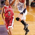Fayetteville senior guard Sierra Shipley shoots over Fort Smith Northside junior guard Chatara Roger...