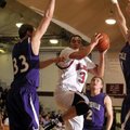 Springdale High’s Shelton Baird, center, works his way through a trio of Fayetteville defenders duri...